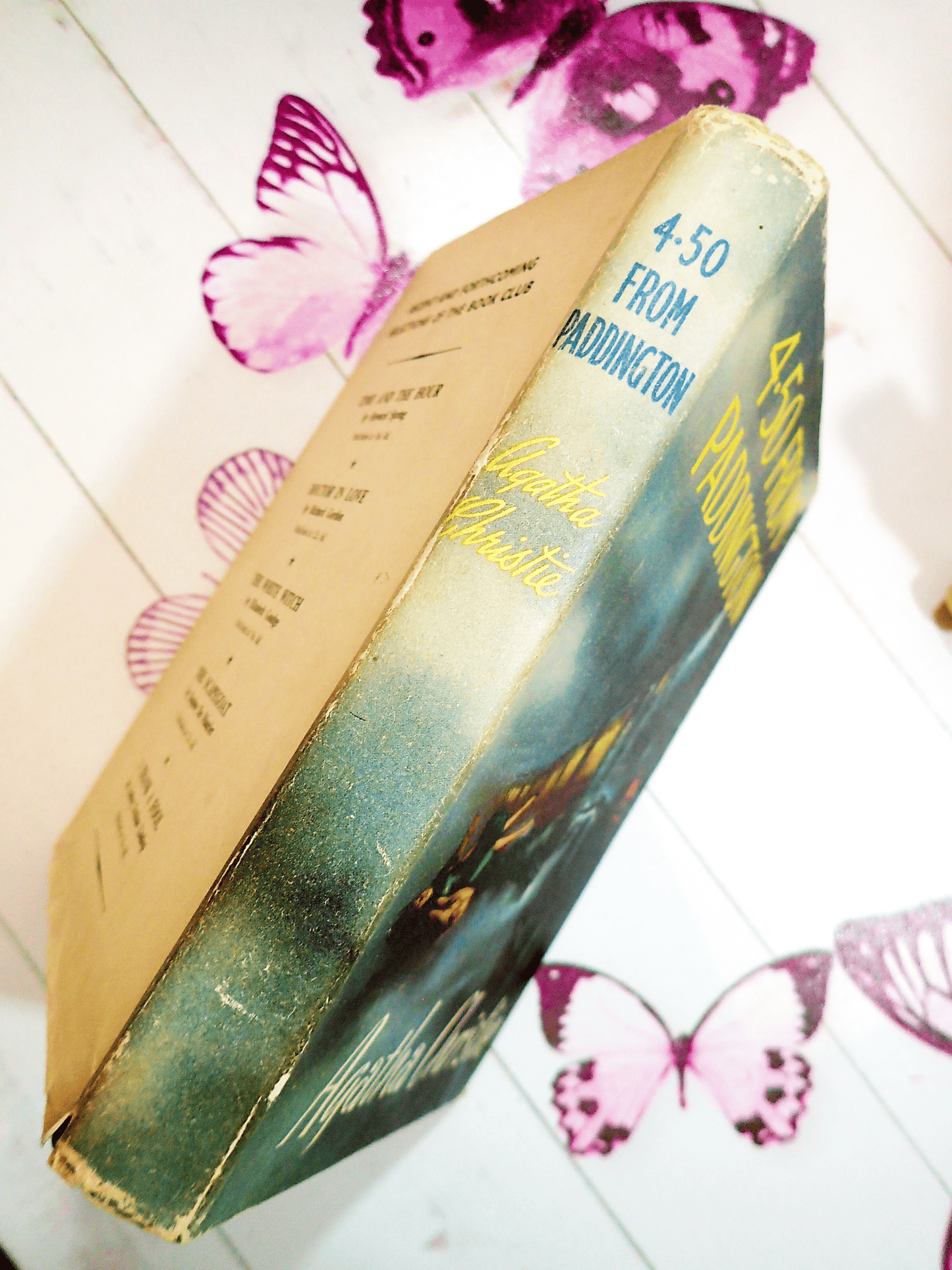 Agatha Christie 4.50 from Paddington Classic Vintage Crime Fiction book showing Blue and Yellow titles on the spine.