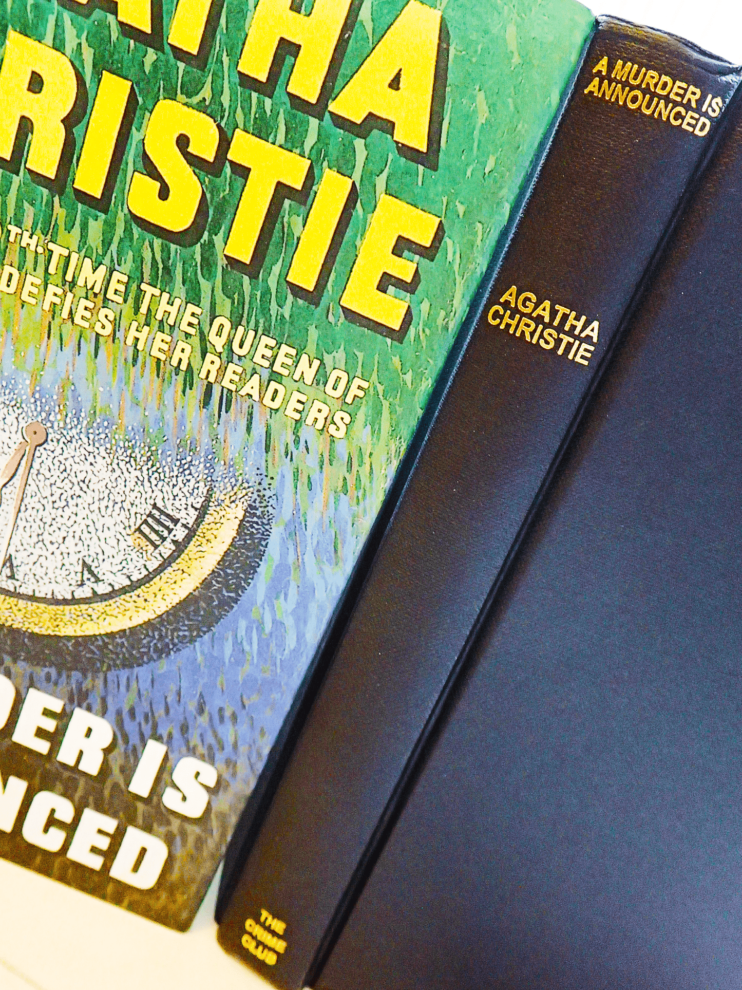 Spine of Agatha Christie A Murder is Announced showing black cloth binding and gilt titles against the illustrated dust jacket.