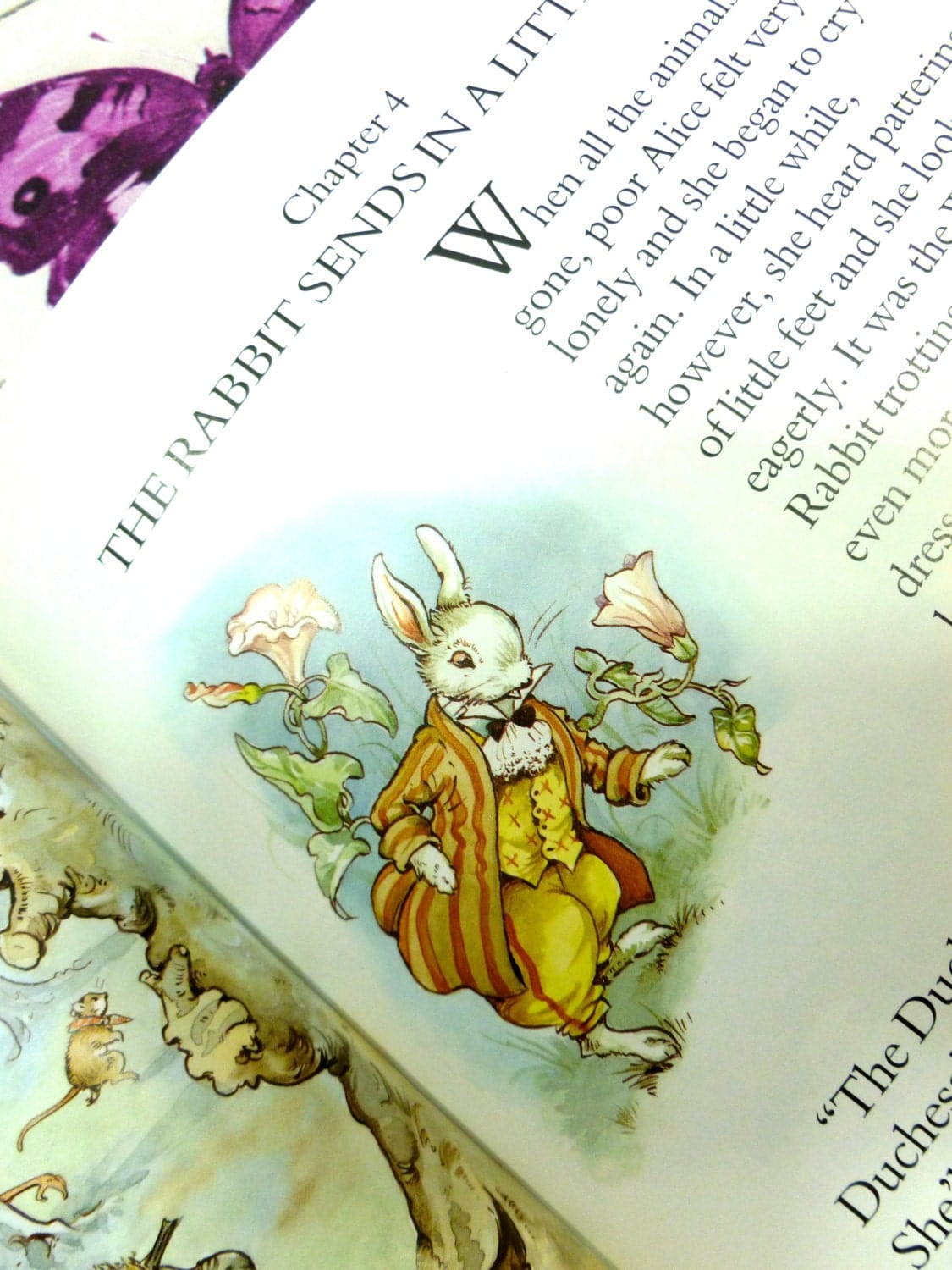 The Mad Hatter, Rabbit in stripey suit and cravat, illustration from vintage Alice in Wonderland book by Rene Cloke.