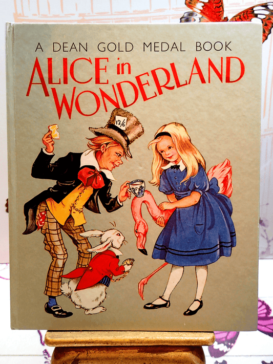The Mad Hatter, White Rabbit and Alice on the Front cover of Alice in Wonderland Dean Gold Medal Book Hardback
