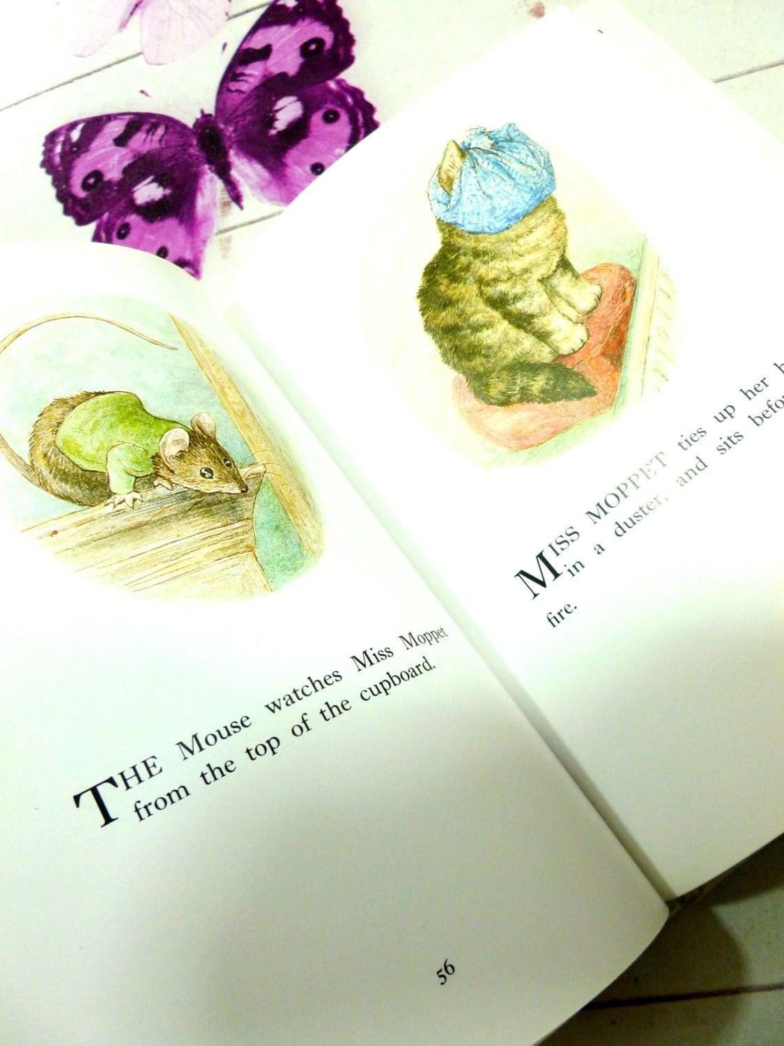 Pages from Beatrix Potter Best Loved Tales showing watercolour illustrations of a mouse watching Miss Moppet the tabby cat.