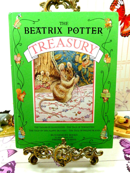 Front cover of The Beatrix Potter Treasury lovely vintage Childrens Book, Tailor of Gloucester etc. 1990's showing the mice from the story the Tailor of Gloucester against a green border and titles.