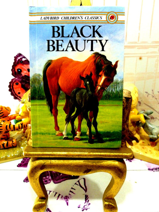 Cover of Black Beauty Vintage Ladybird Book Well Loved Tales showing beautiful Bay horse with black foal. 