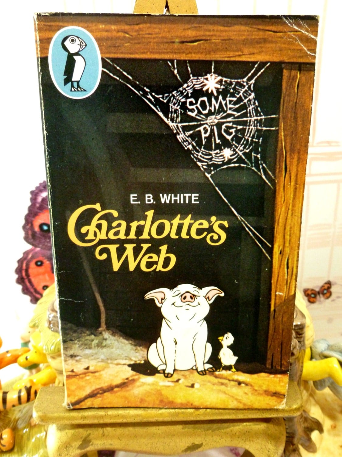 Front cover of Charlottes Web Vintage Puffin Paperback showing Charlotte the pig and as spiders web.