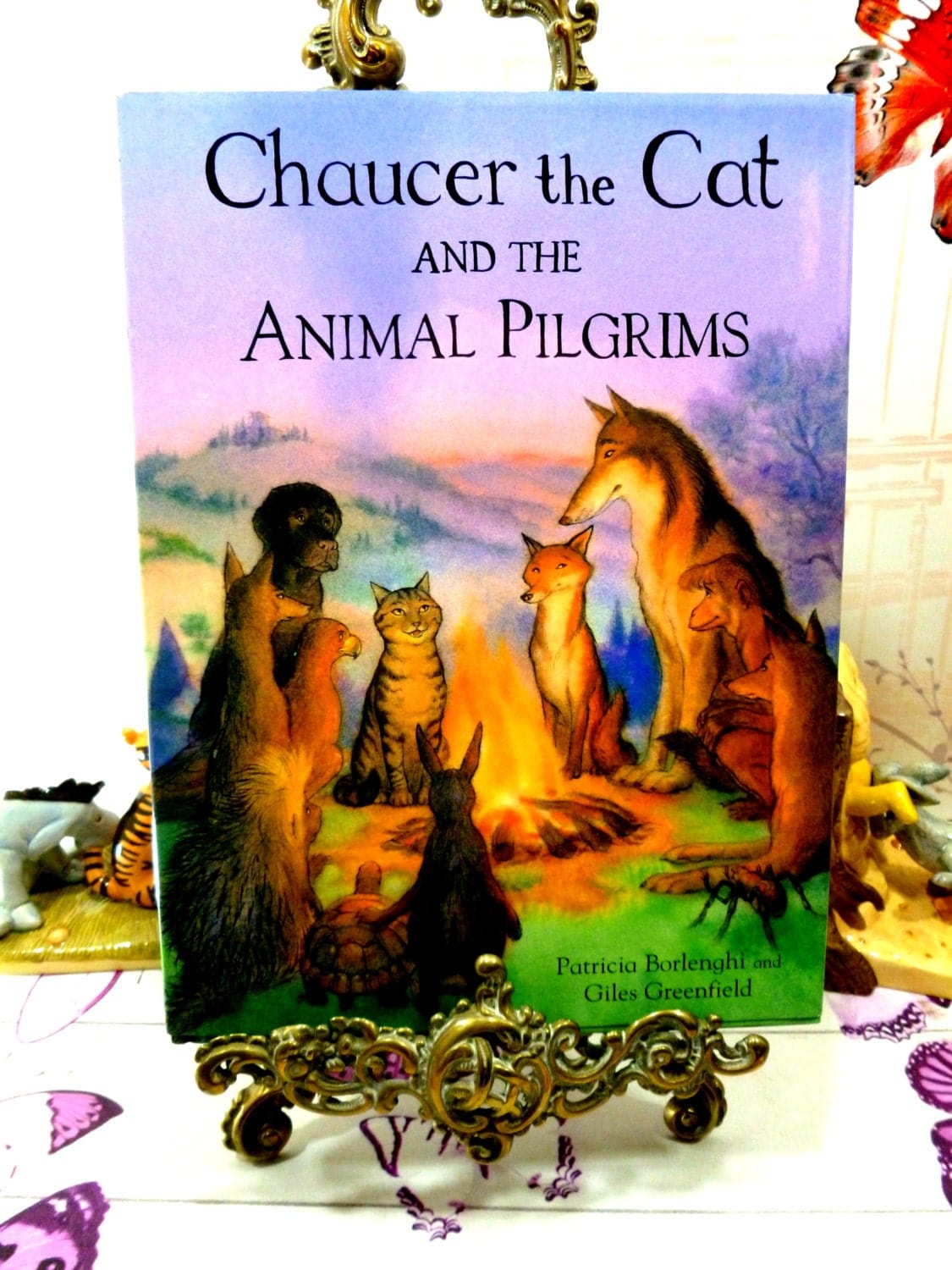 Cover of vintage children's book Chaucer the Cat and the Animal Pilgrims showing animals sat round a campfire.