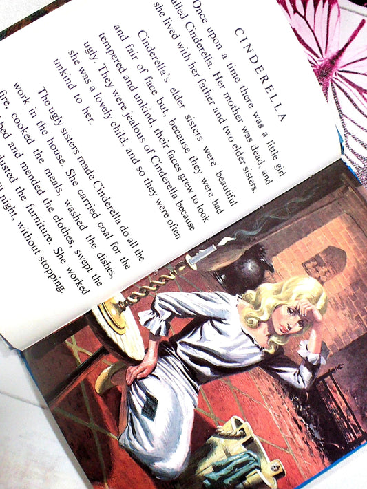 Once upon a time there was a little girl called Cinderella. Cinderella in ragged gown looking very tired.