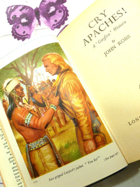 Illustration from Cry Apache Catsfoot Cowboy Stories 1960s Vintage Hardback children's book showing an Indian in full headdress: Earo gripped Catsfoot's jacket. "You lie!"