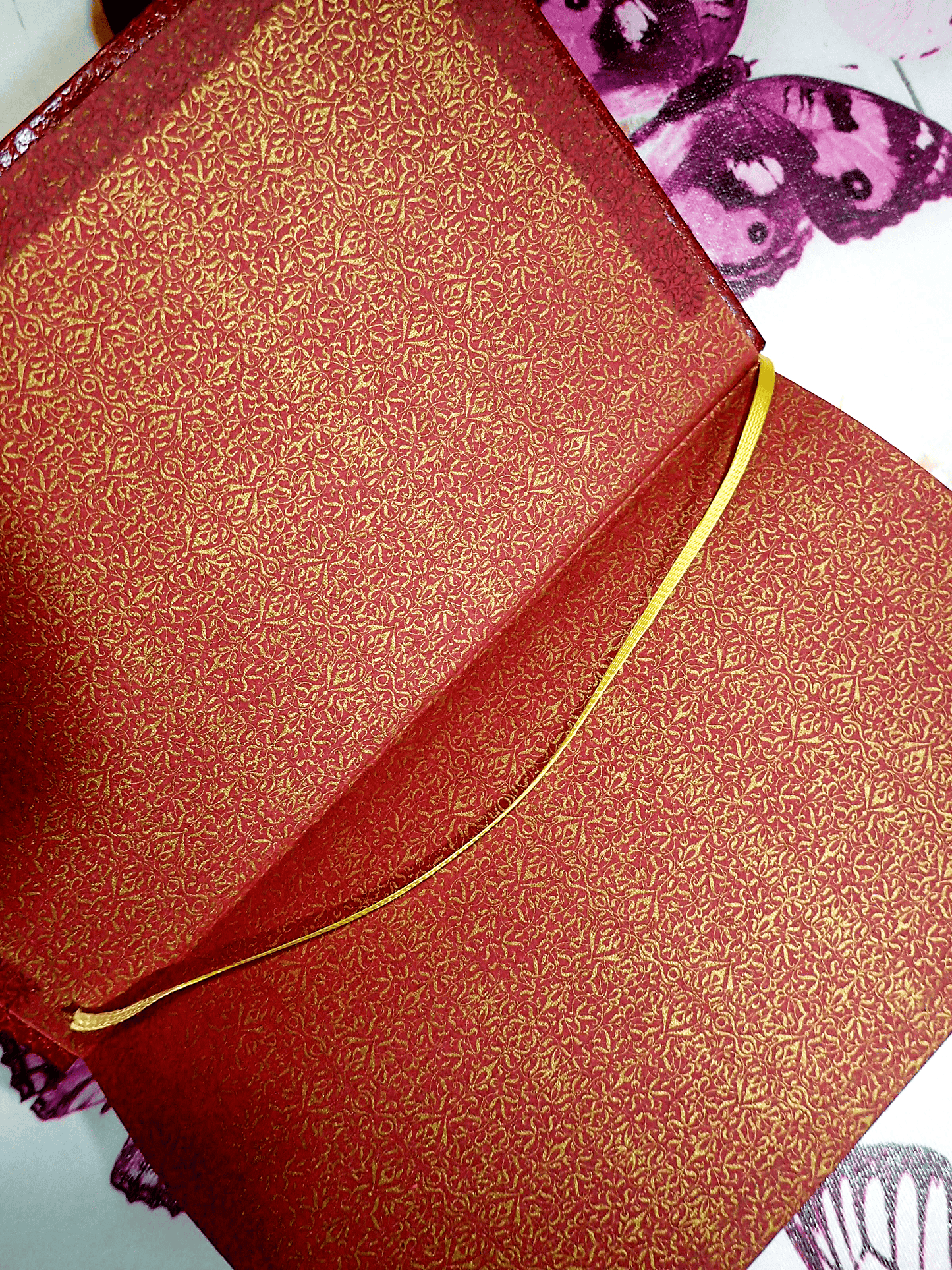 The Devil Rides Out Red and gilt endpapers of Dennis Wheatley Faux Red Leather with yellow silk ribbon.