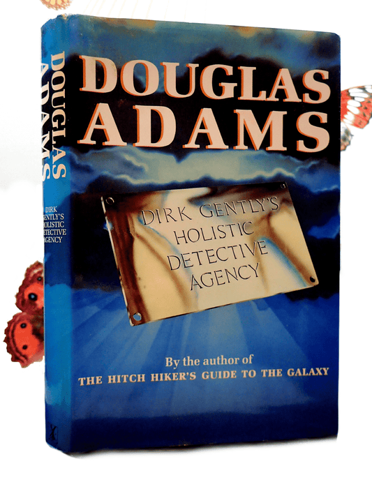 Front Cover showing a cloudy sky and the sign of Douglas Adams Dirk Gently's Holistic Detective Agency Signed First Edition Book