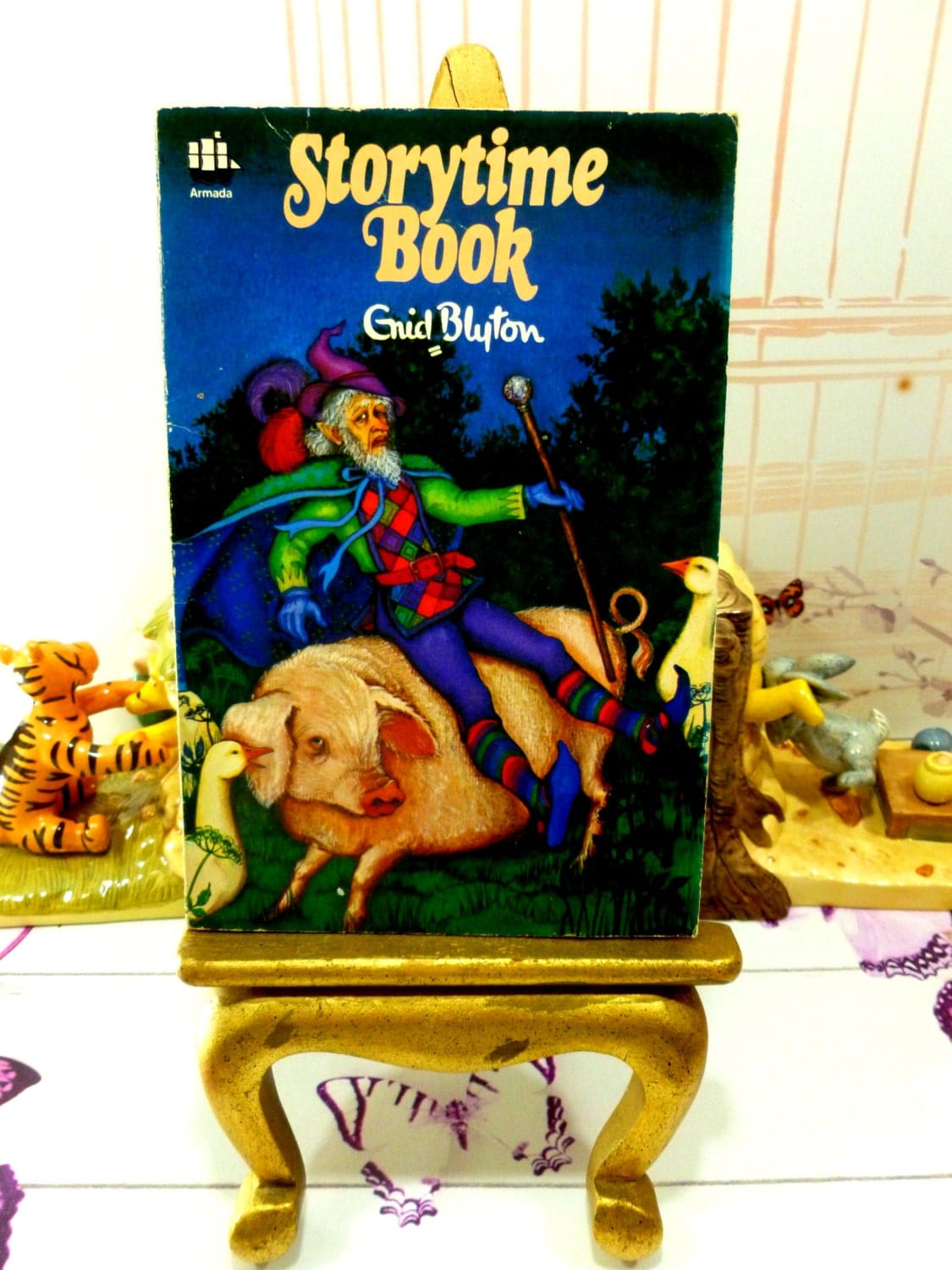 Fron cover of Enid Blyton Storytime Book Vintage Paperback Armada 1970s showing a fairytale gnome riding a pig.