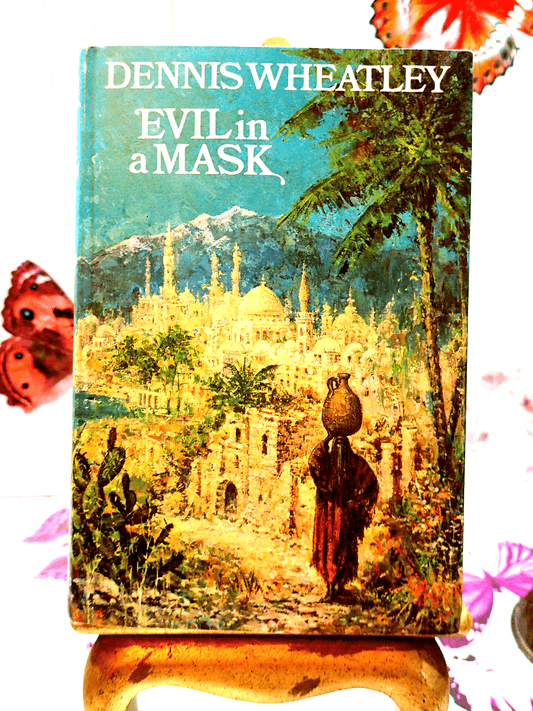 Front cover of Evil in a Mask Dennis Wheatley Vintage Book BCA 1960's Showing a figure walking against an eastern landscape.