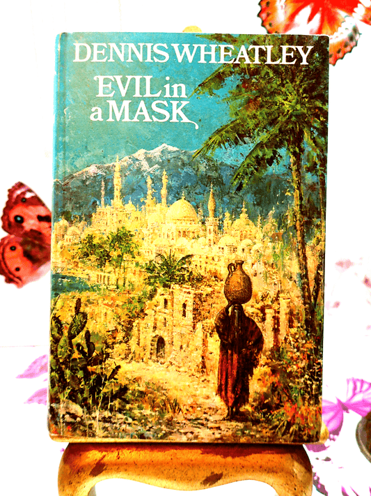 Front cover of Evil in a Mask Dennis Wheatley Vintage Book BCA 1960's Showing a figure walking against an eastern landscape. 