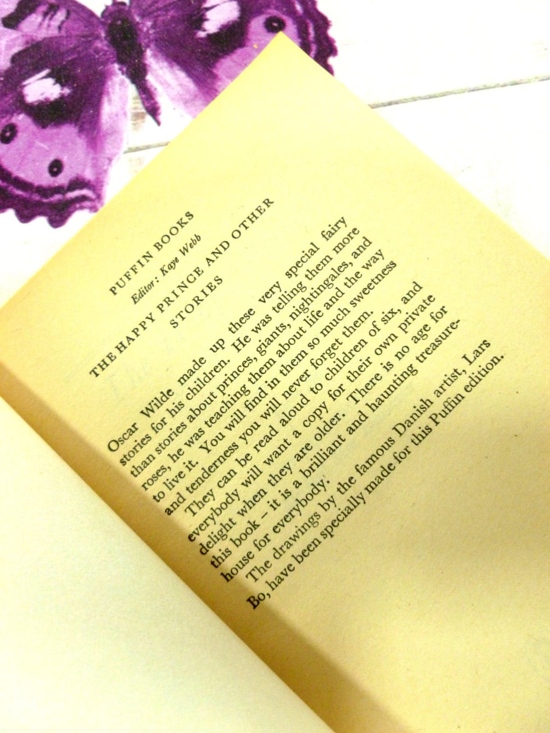 Page of The Happy Prince and other Stories Classic Childrens Book Vintage Puffin Book Paperback 1970s showing text: Oscar Wilde made up these and other stories...