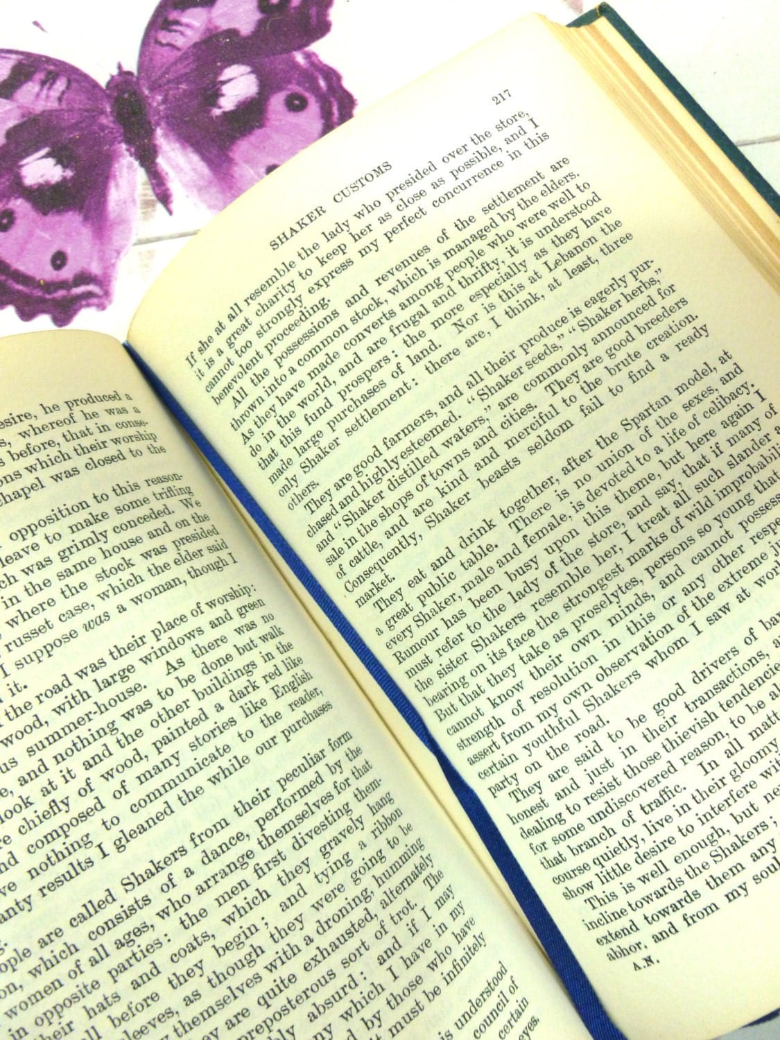 Pages of American Notes and Pictures from Italy by Charles Dickens with thin blue silk ribbon book mark.