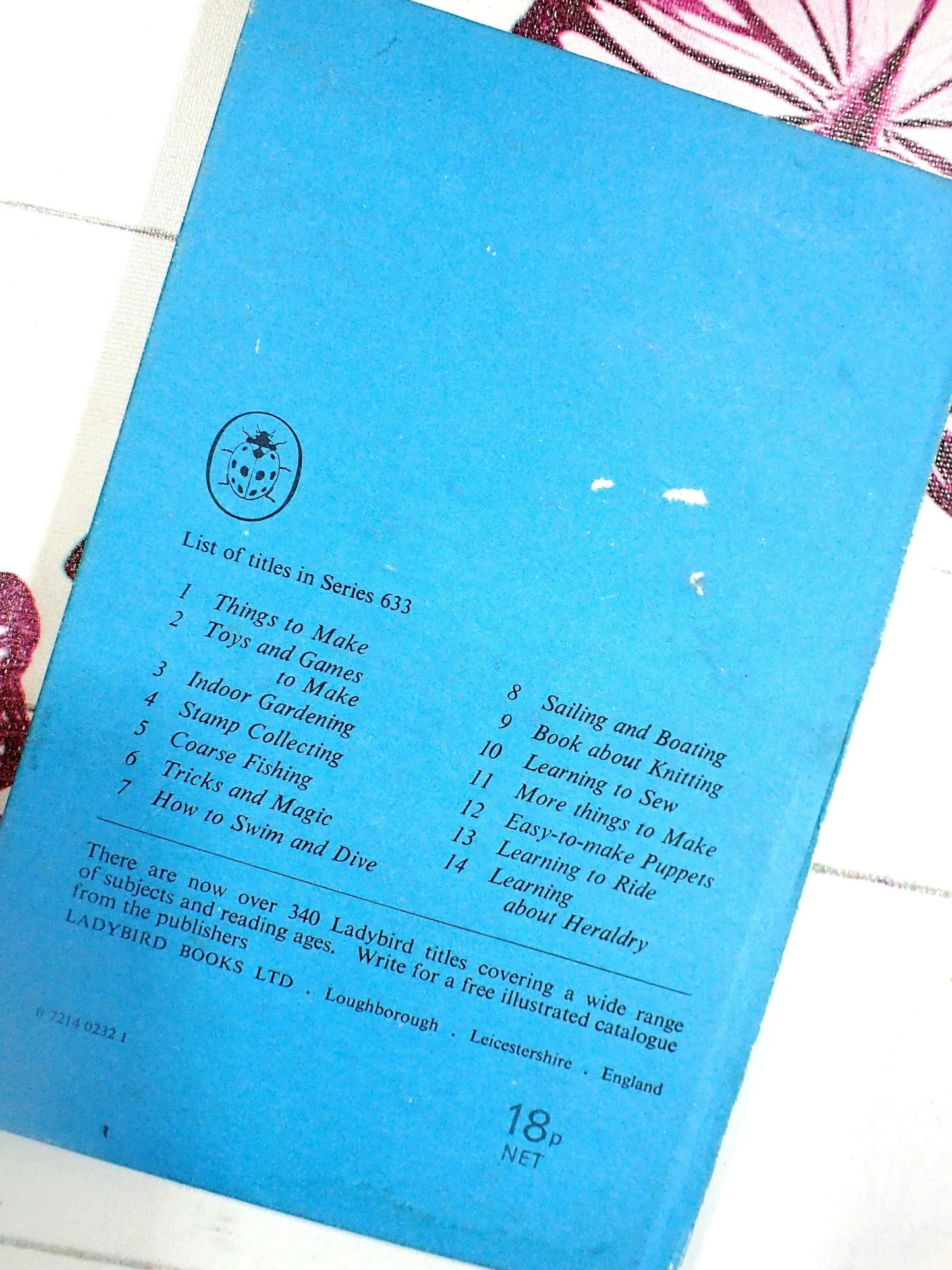 Back cover of vintage ladybird book coloured blue.