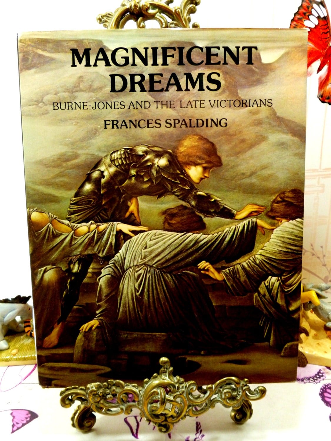 Front cover of Magnificent Dreams vintage hardback book about Burne Jones and The Victorian Pre Raphaelites showing a vignette from a pre-raphaelite painting.