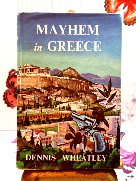 Front cover of Mayhem in Greece Dennis Wheatley Vintage Book BCA showing a Greek landscape with a gun. 