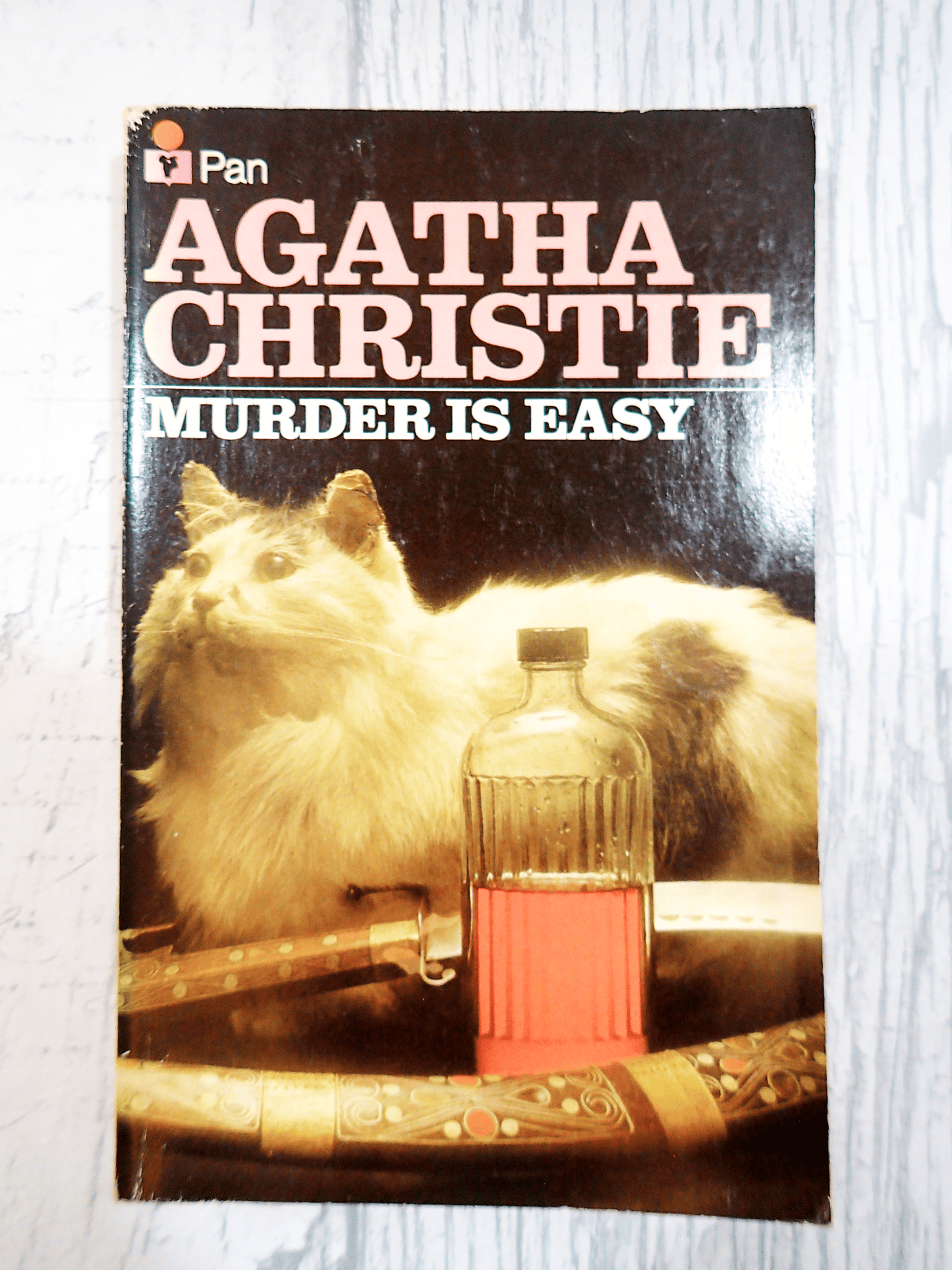 Agatha Christie Murder is Easy cover of Vintage Pan Paperback showing a cat with a poison bottle. Classic Crime book.