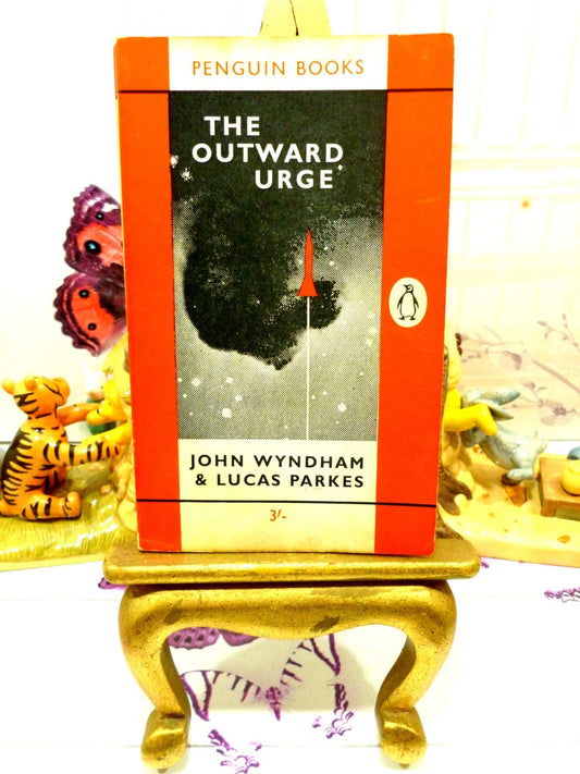 Front cover in orange with space rocket image of The Outward Urge Vintage Penguin Orange Paperback Book. John Wyndham Classic Sci Fi.