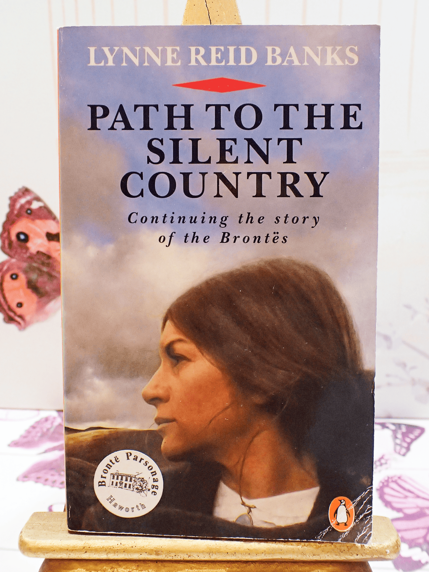 Front cover of vintage Bronte interest book 'Path to the Silent Country' by Lynne Reid Banks - showing a wistful woman gazing over the moors.
