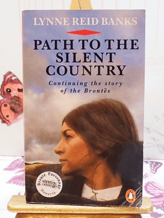Front cover of vintage Bronte interest book  'Path to the Silent Country' by Lynne Reid Banks - showing a wistful woman gazing over the moors. 