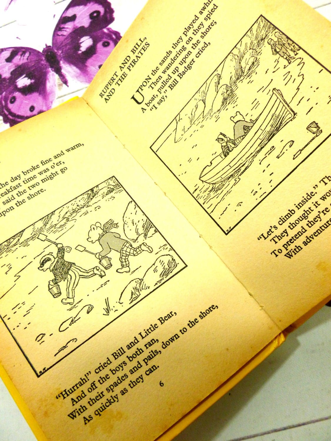 Black and white pages of yellow book showing Rupert and Bill at the seaside Mary Tourtel Little Bear Library number 5 1970s Vintage Hardback Rupert Book 1st Ed