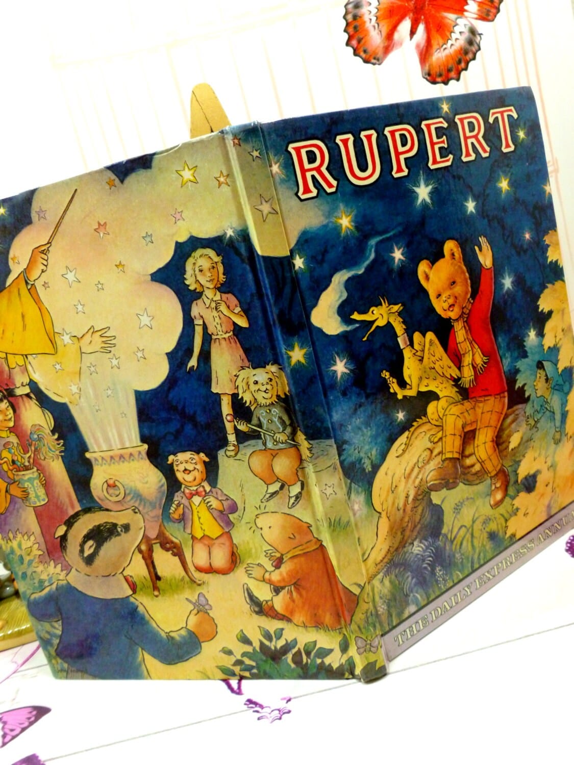 Vintage Rupert the Bear Annual 1979 with Dragon and stars on the Cover and other Rupert the bear characters.