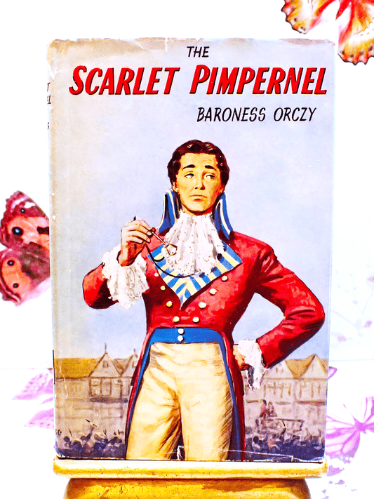 Front Cover of The Scarlet Pimpernel by Baroness Orczy Thrilling Romance Classic 1940's Vintage Book showing Sir Percy Blakeney looking foppish. 