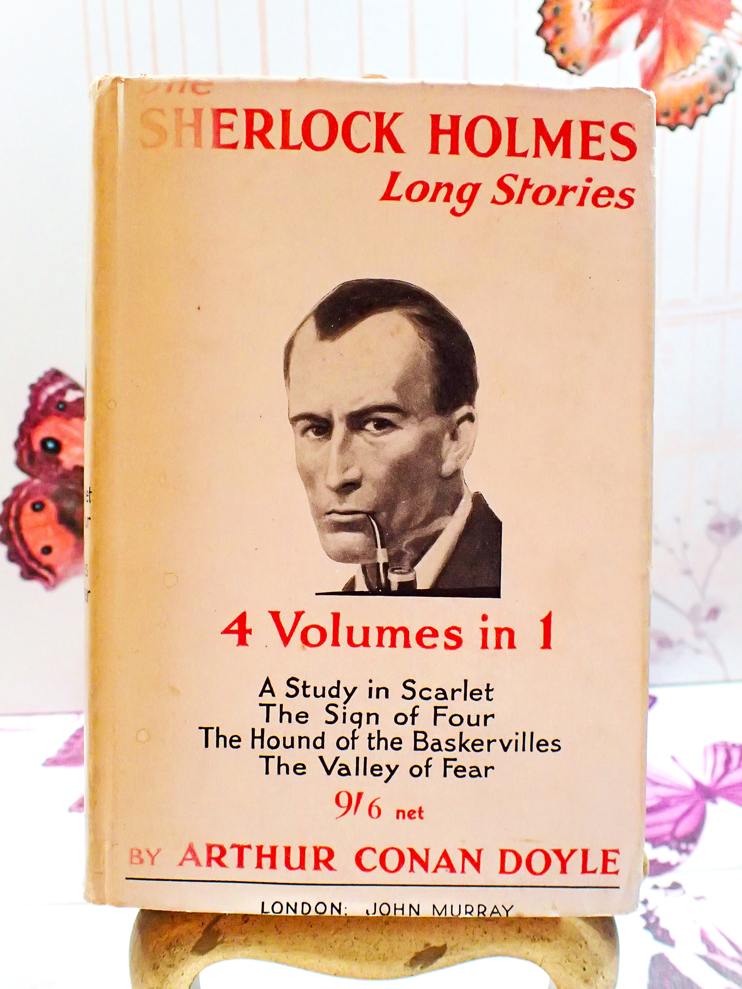 Front cover of Sherlock Holmes Long Stories Arthur Conan Doyle Showling Sherlock smoking a pipe.