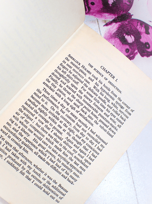 First Page of The Sign of the Four Arthur Conan Doyle Vintage Book showing text: "Chapter I. The Science of Deduction..."