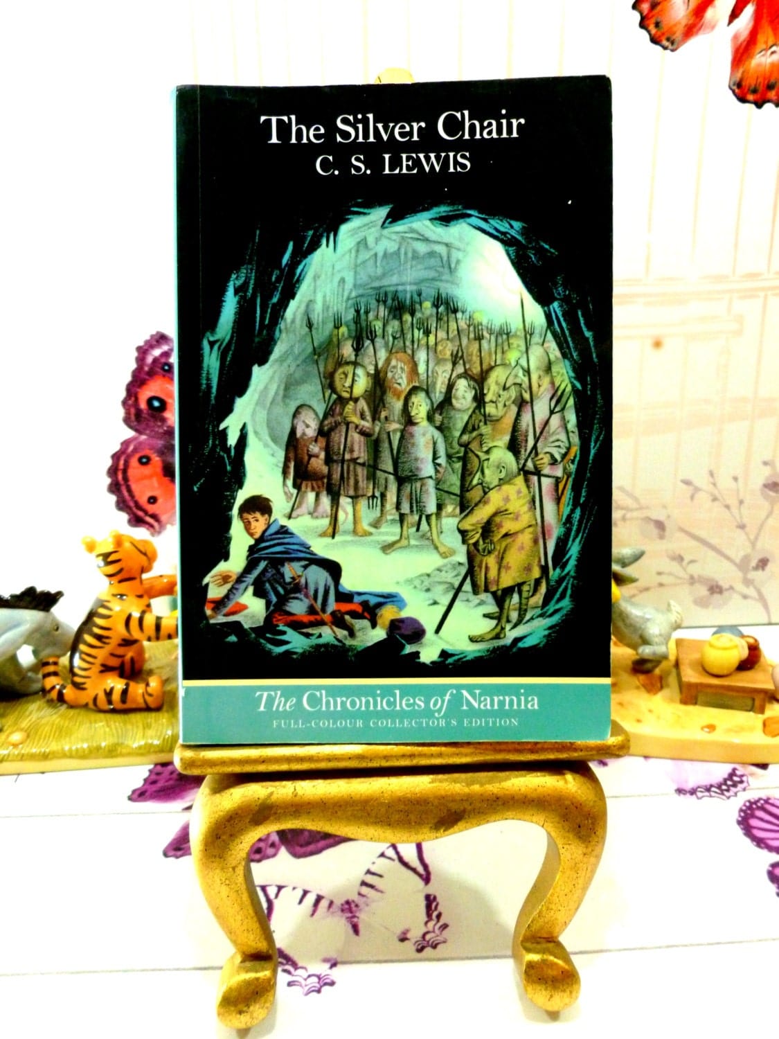 Front Cover of 'The Silver Chair' vintage children's book showing Eustace in cave underground surrounded by strange creatures.