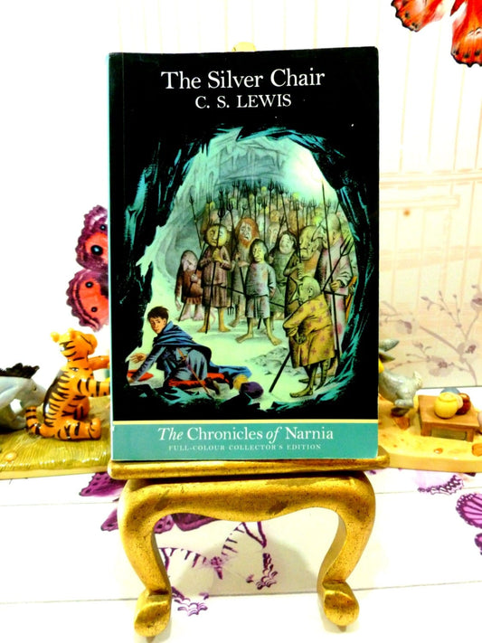 Front Cover of 'The Silver Chair' vintage children's book showing Eustace in cave underground surrounded by strange creatures.