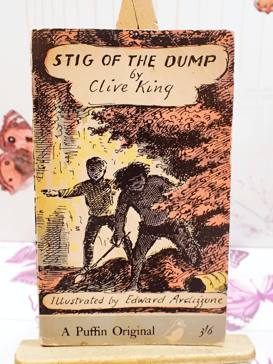 Front cover of Vintage children's classic paperback book Stig of the Dump by Clive King showing Stig and his friend Barney in the rubbish dump. 