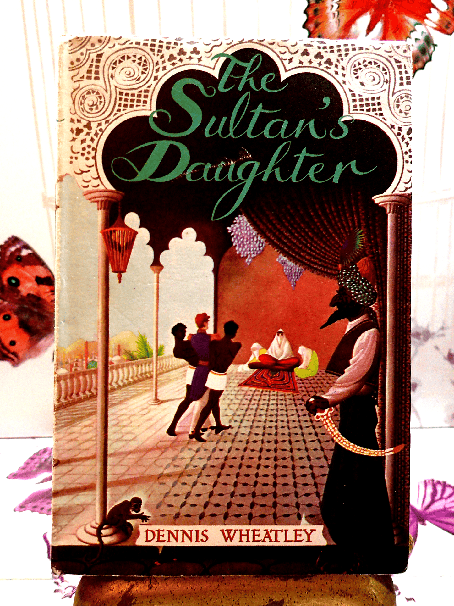 Front cover of The Sultans Daughter Dennis Wheatley Vintage Book BCA Showing a man in a turban and a monkey.