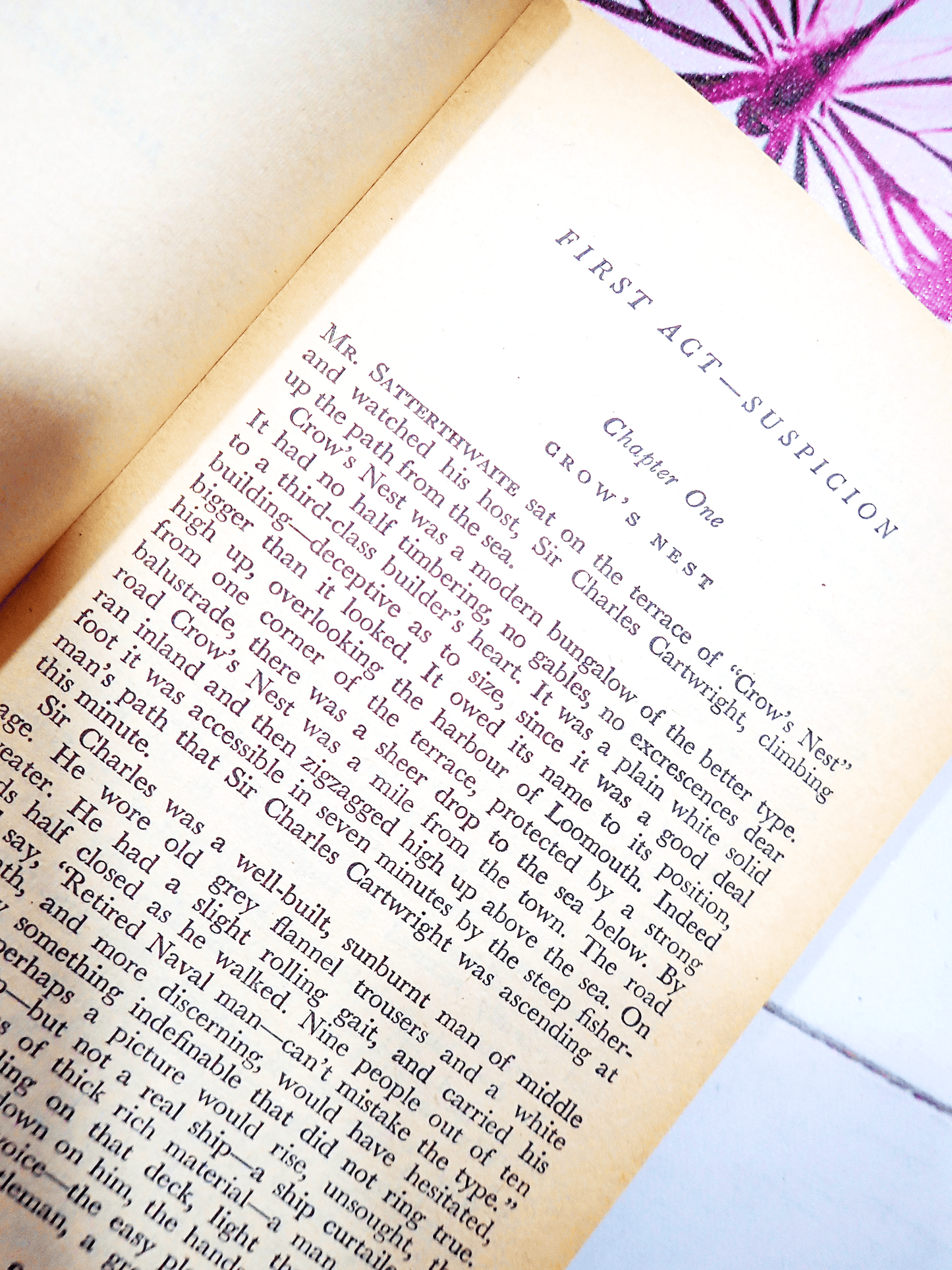 Pages of Three Act Tragedy by Agatha Christie Vintage Pan Paperback Classic Crime book showing text: " First Act - Suspicion, Chapter One, Crows Nest. Mr Satterthwaite sat on the terrace...."