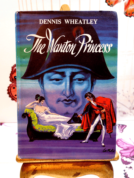 Front cover of The Wanton Princess Dennis Wheatley first edition thus, showing a looming image of Napoleon and the hero Roger Brook bowing to a lady on a chaise longue.