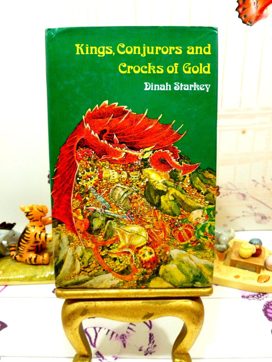 Front cover of Kings Conjurors and Crocks of Gold 1975 folk tale book with colourful dragon on its hoard against a green ground.