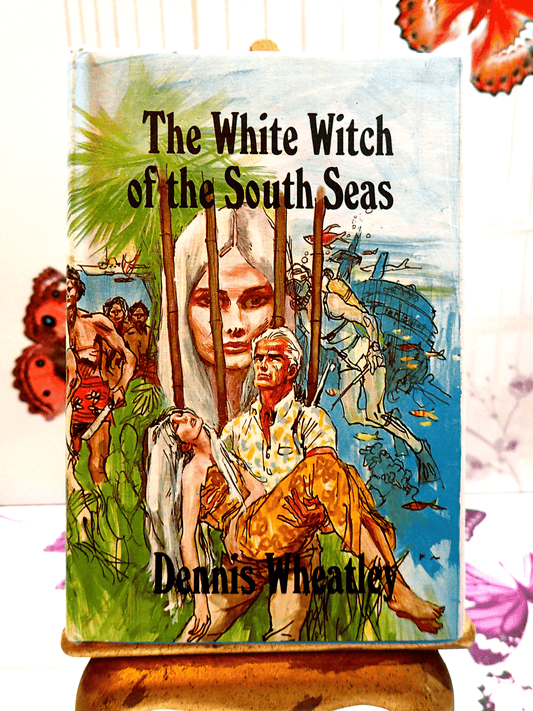 Front cover of The White Witch of the South Seas Dennis Wheatley 1960's Vintage Book First Edition Hardback BCA showing a handsome man carrying an elegant woman with long white hair.