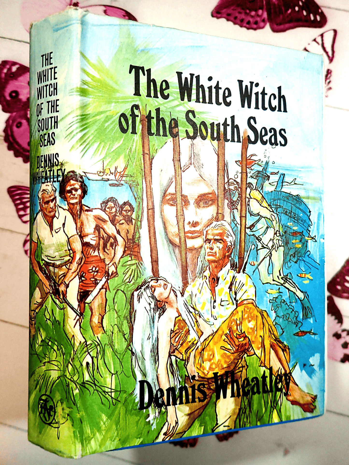 Front cover of The White Witch of the South Seas Dennis Wheatley 1960's Vintage Book First Edition Hardback BCA showing a handsome man carrying an elegant woman with long white hair.