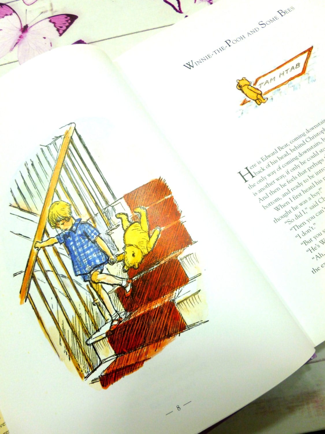 Christopher Robin carrying Pooh Bear down the stairs colour illustration from Front cover of A World of Winnie the Pooh Vintage Hardback Childrens Book.