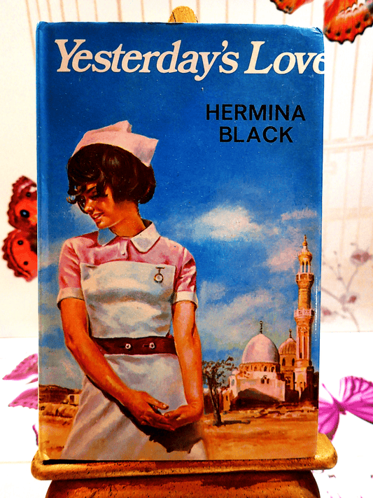 Front cover of Yesterdays Love Hermina Black Romance Book Club Hardback showing a nurse in a vintage uniform. 