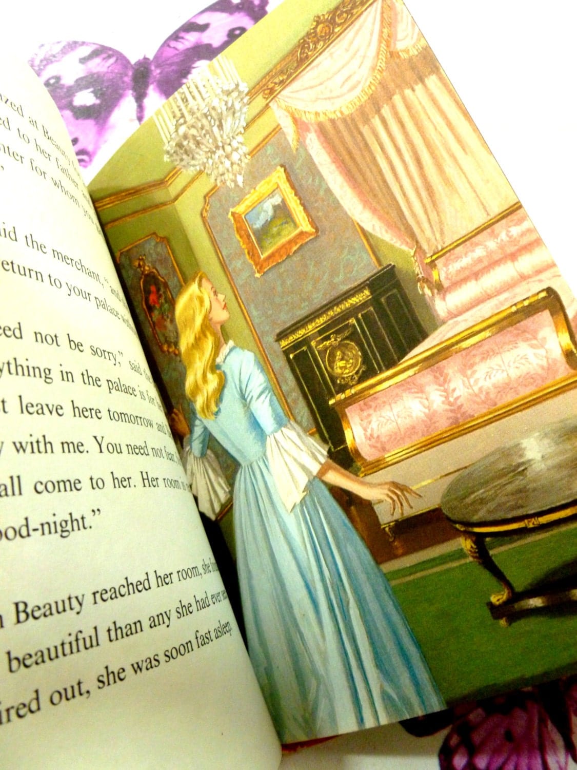 Illustration from Ladybird Vintage Children's book Beauty and the Beast Well-Loved Tales showing a beautiful lady in a blue dress in front of a luxurious bed