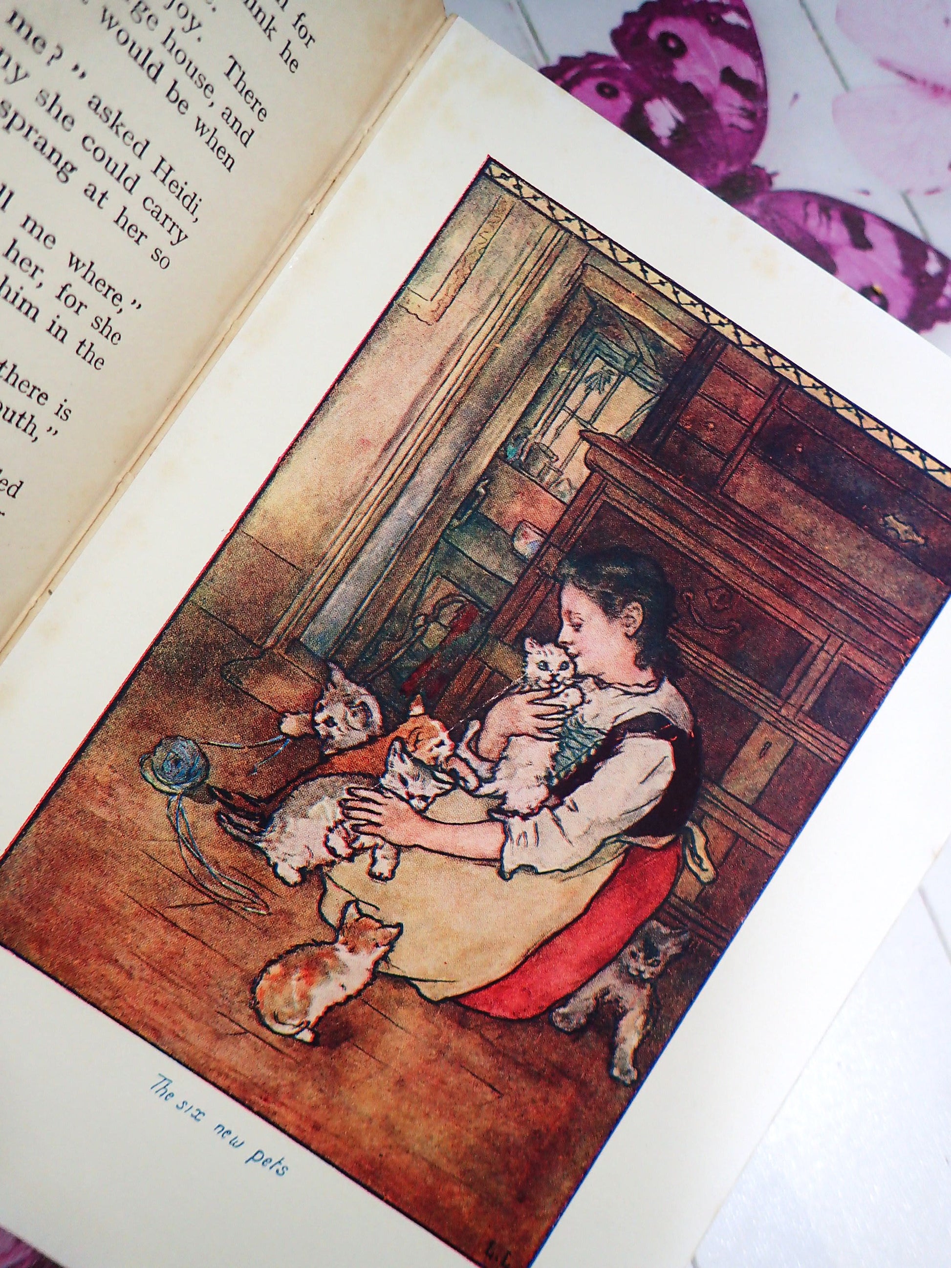 Illustration of Heidi and kittens in Favourite Classic Book Heidi by Johanna Spyri vintage 1930's illustrated edition.