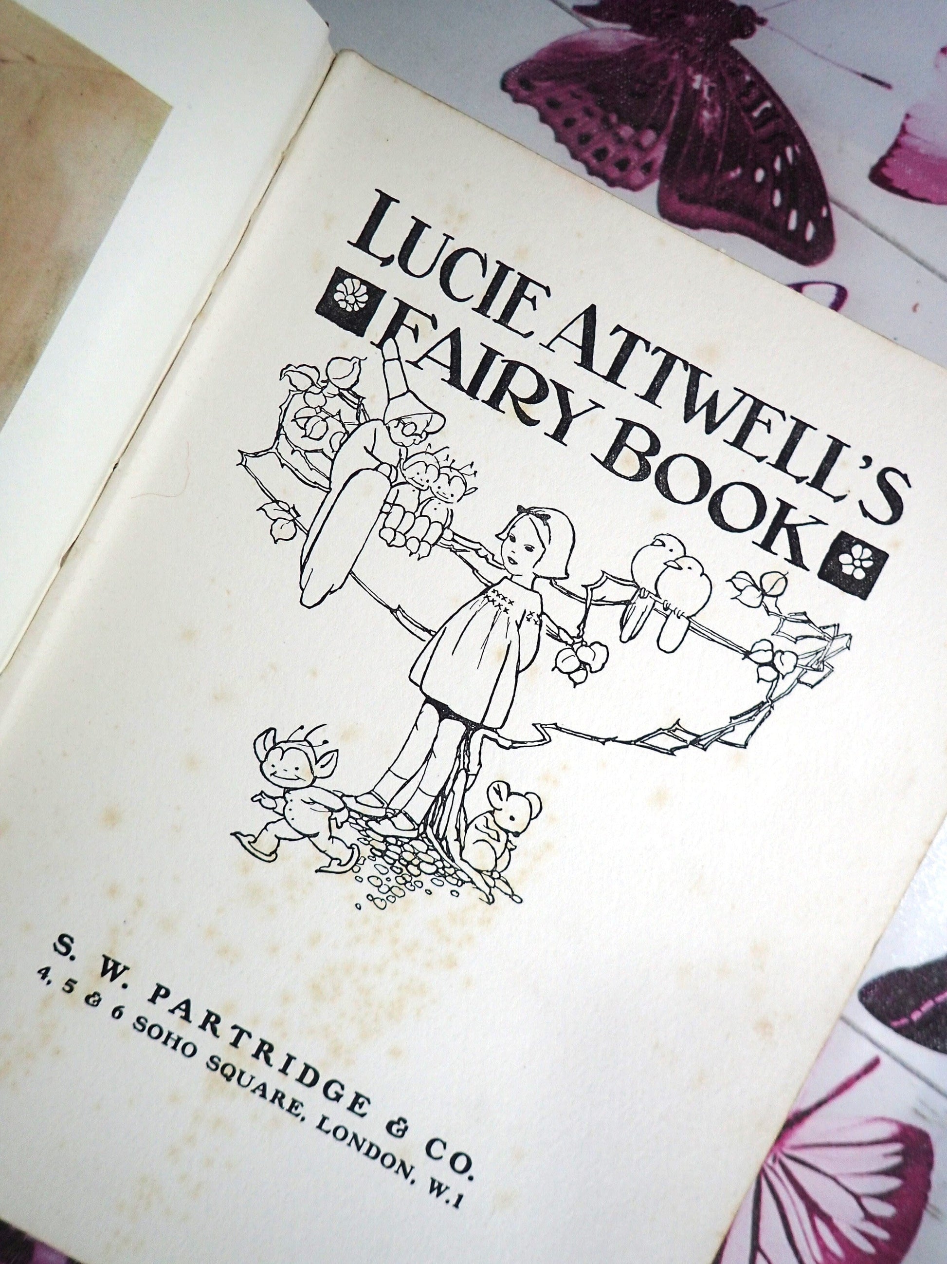 Title page of Lucie Attwell's Fairy book with line drawn illustrtation.