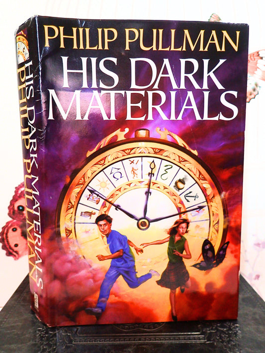 Philip Pullmans His Dark Materials Hardback Book with Lyra Will and The Alethiometer.