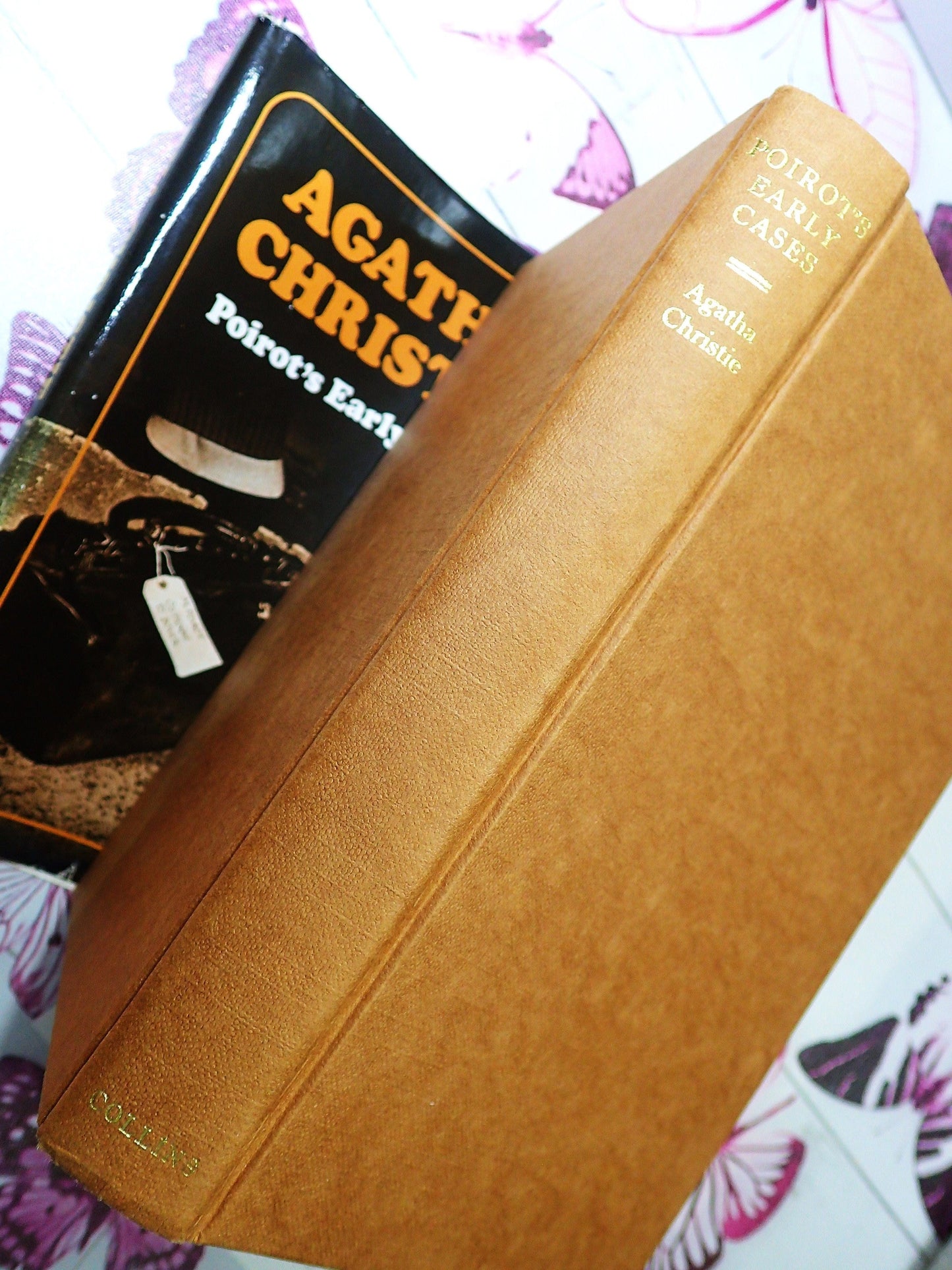 Brown cloth and gilt titles on binding of Poirot's Early Cases first edition Agatha Christie