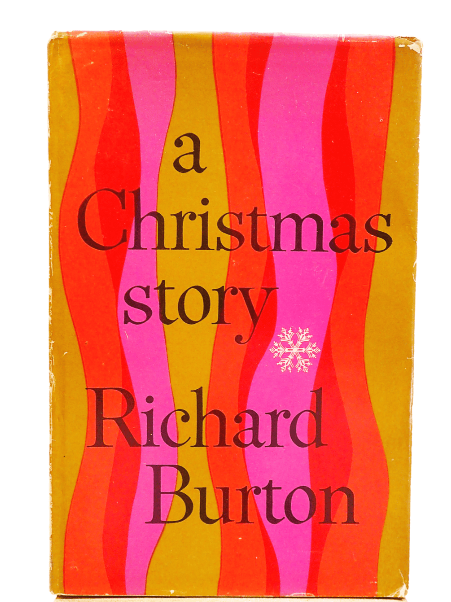 A Christmas Story by Richard Burton, hardback book with colourful stripy cover, first edition against a light background.