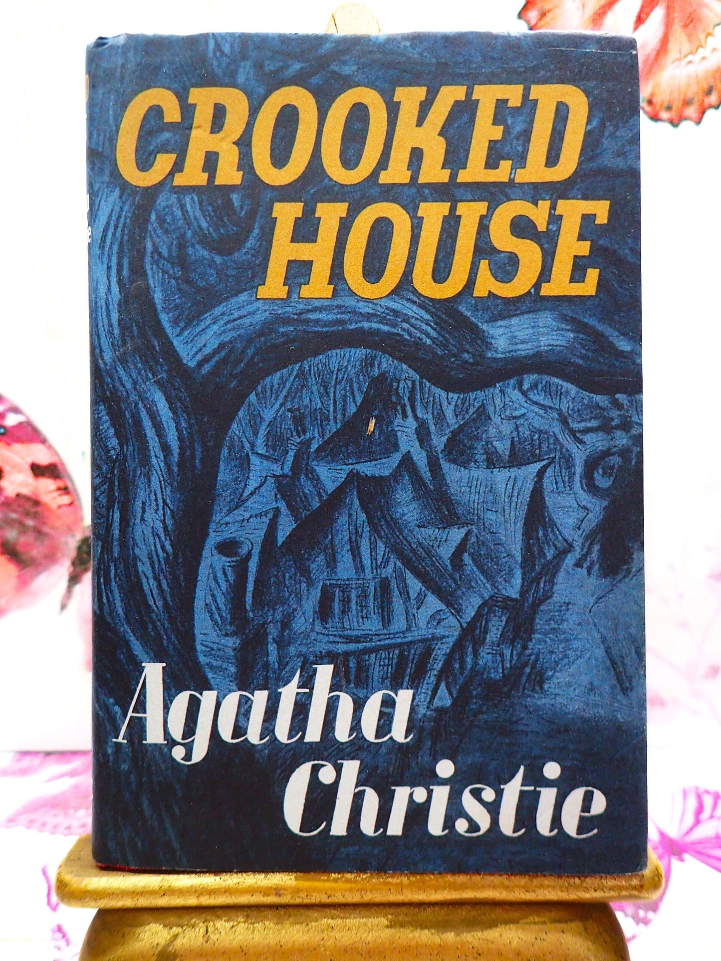 Front Cover of The Crooked House by Agatha Christie showing Creepy House in the woods