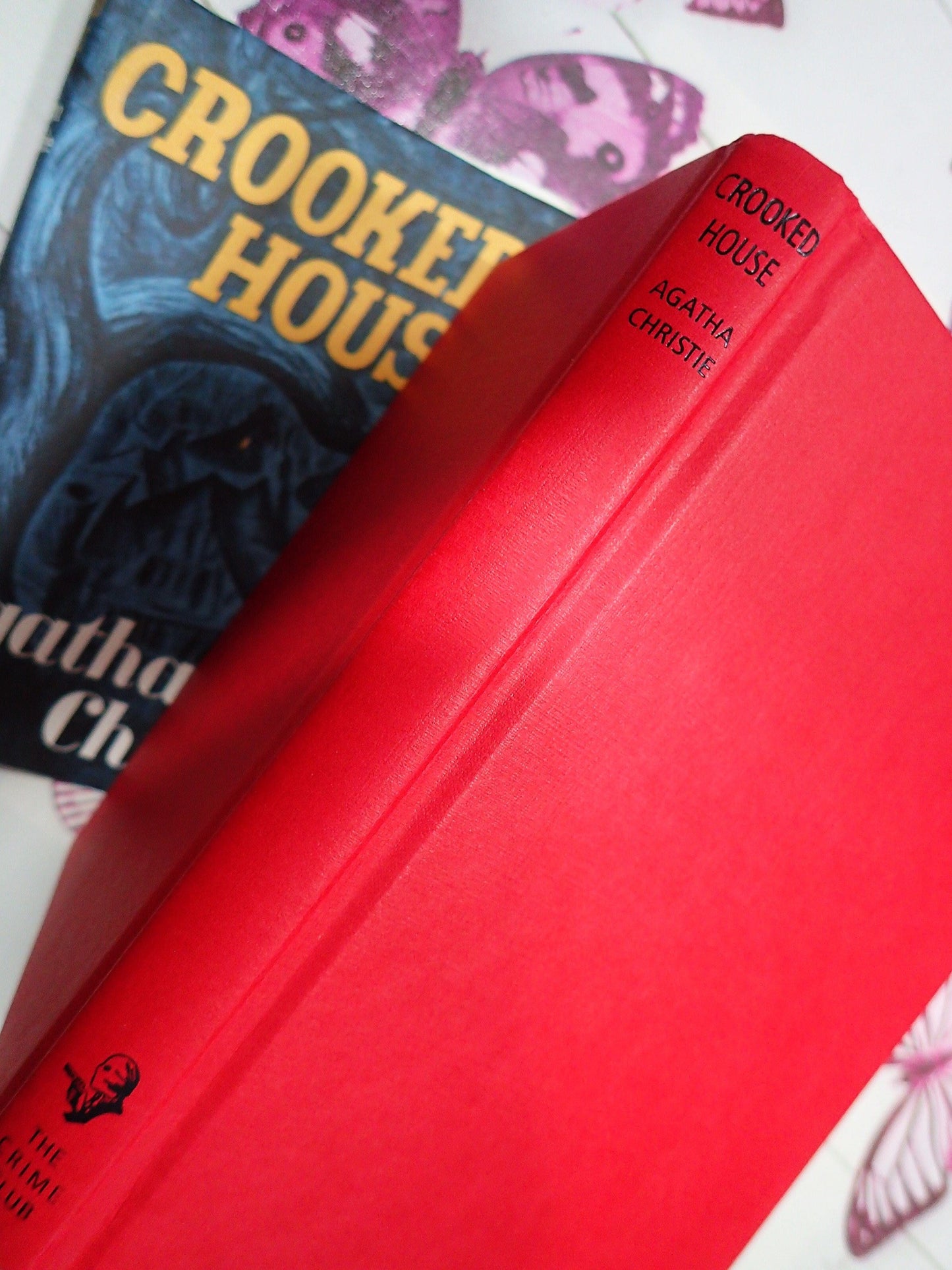 Red Binding and Black Titles on book The Crooked House by Agatha Christie