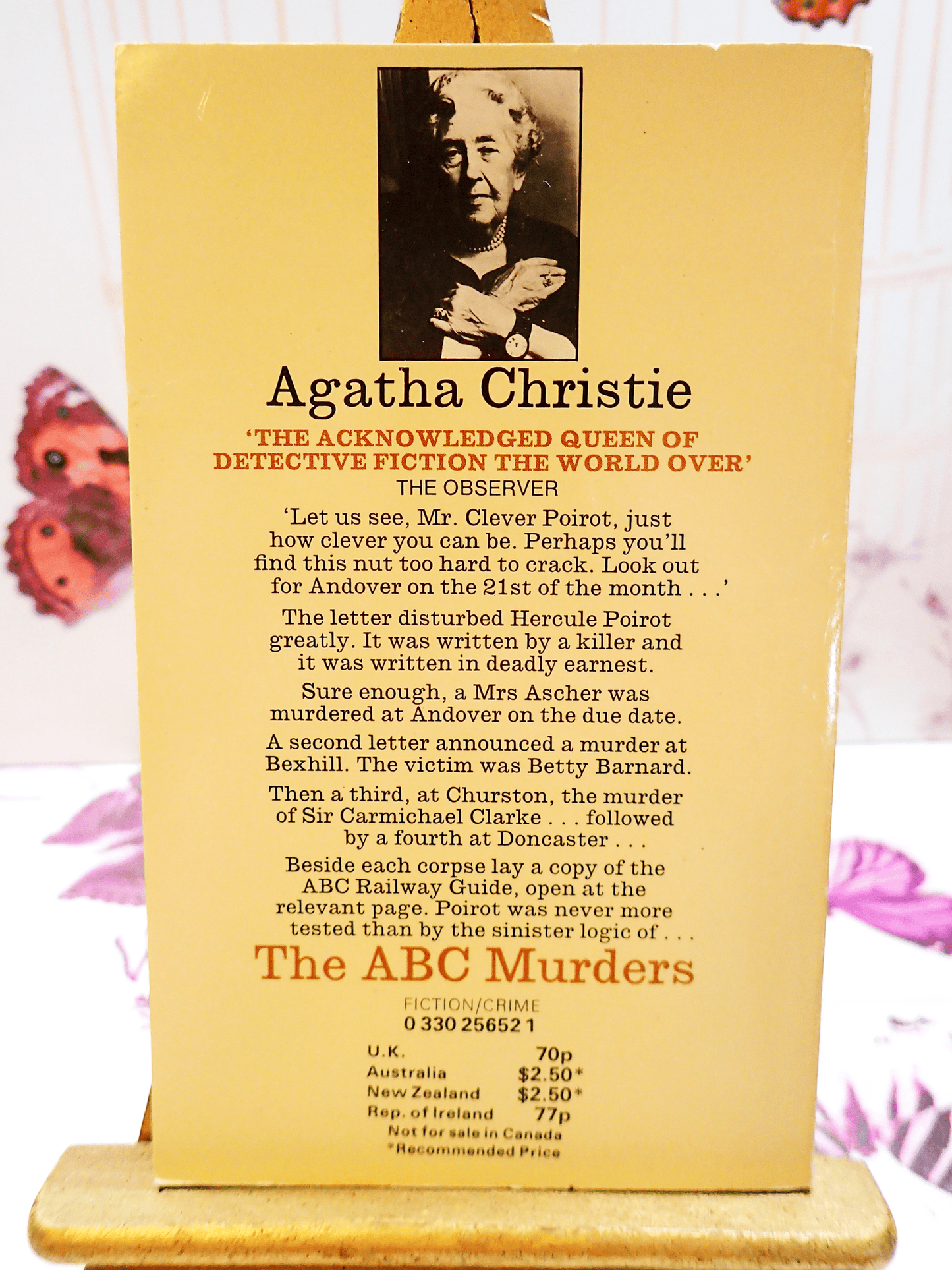 Front Cover of Agatha Christie The ABC Murders, Vintage Pan Paperback Book. Classic Crime Fiction. Showing a black and white photo of Agath Christie with book blurb: "Let us see, Mr. Clever Poirot..."